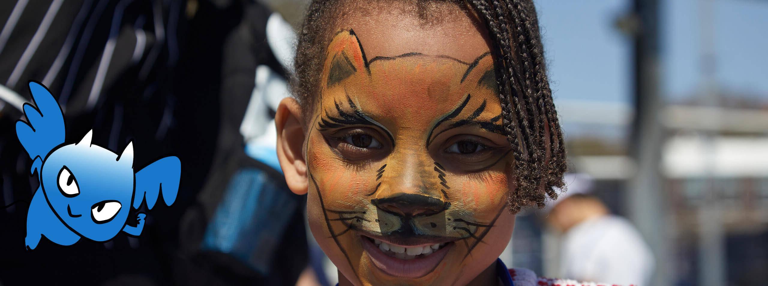 Face painted child with Blue Devil sidekick